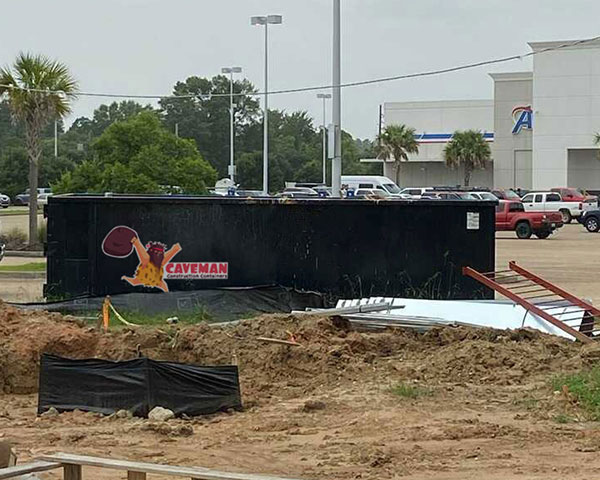 dumpster by construction of building