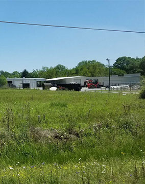 roll off dumpster near company building